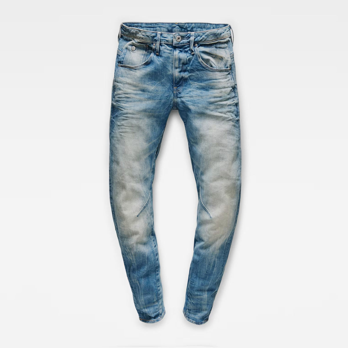 Front view of medium blue boyfriend jeans with a skinny fit and distressed look on a transparent background.
