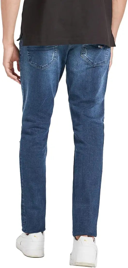 Tommy Hilfiger mid wash jeans, back view on model