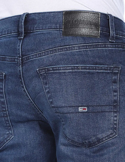 Close-up of Tommy Jeans faded denim back pocket and leather patch