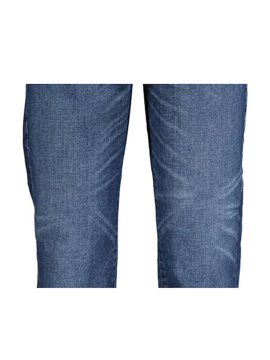 Close-up of GUESS blue jeans lower legs and hem