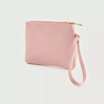 Gloo Studded Alphabet G Pouch, open with zipper visible. Silver pouch with black studs forming the letter 'G'. Wrist strap attached with tag.