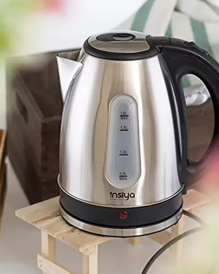 Insiya 1.8L electric kettle pouring water into a mug, highlighting its convenient spout and rapid boiling. Upgrade your kitchen with the stylish Insiya 1.8L electric kettle, featuring fast boiling and a premium design.