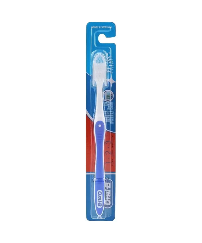 Blue Oral-B Clean, Fresh & Strong toothbrush with medium bristles and a textured tongue cleaner on the back.