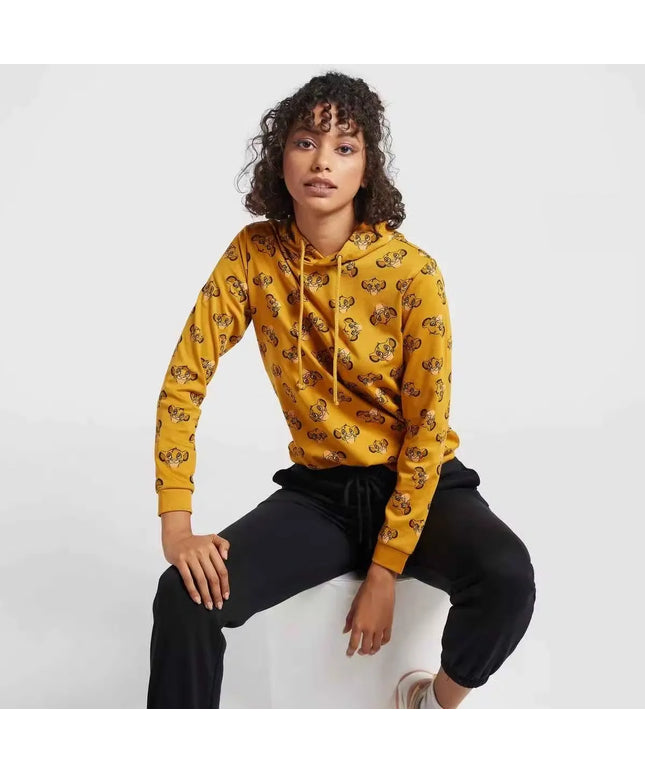 A woman wearing a hooded sweatshirt with a full-body print of The Lion King characters. Cozy up in style with the Max Lion King all-over print women's sweatshirt! Featuring a playful design and comfortable hoodie, this sweatshirt is perfect for casual wear. Shop now on Dubailisit!