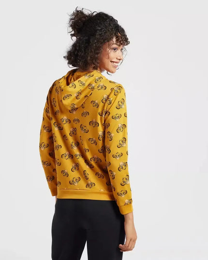 A woman wearing a hooded sweatshirt with a full-body print of The Lion King characters. Cozy up in style with the Max Lion King all-over print women's sweatshirt! Featuring a playful design and comfortable hoodie, this sweatshirt is perfect for casual wear. Shop now on Dubailisit!