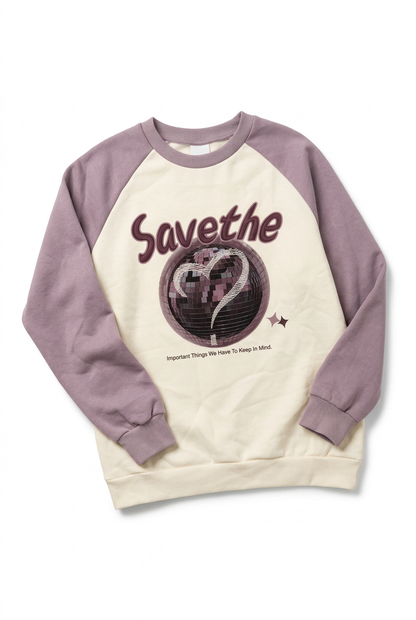 Diyana cream and purple disco ball sweatshirt, angled view
