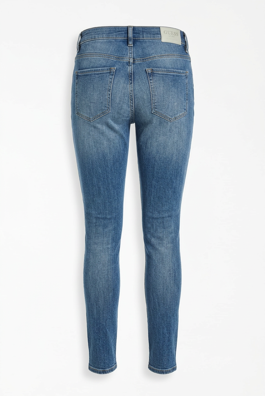 Back view of Guess blue jeggings showing back pockets and leather label