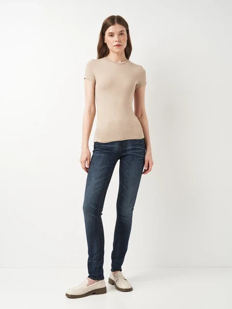 Front view of dark blue skinny fit jeans with a high waist on a white background