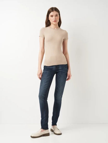 Front view of dark blue skinny fit jeans with a high waist on a white background