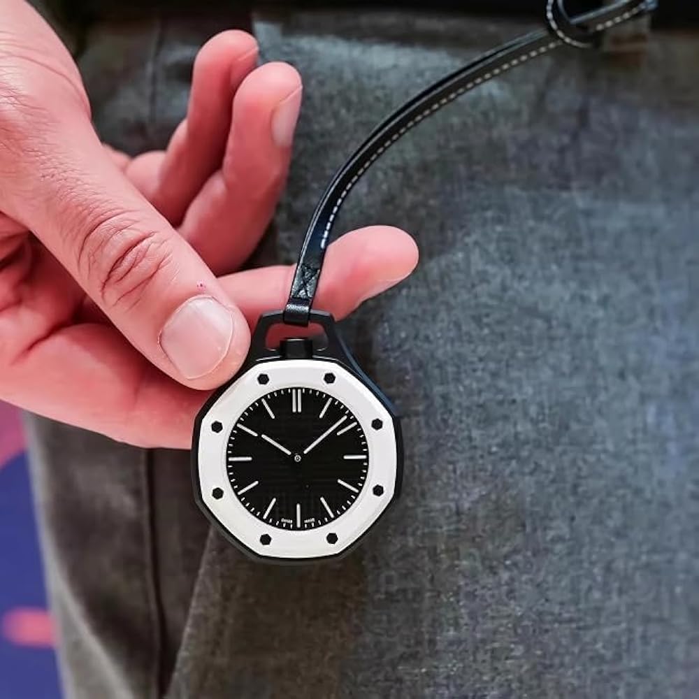 Hand holding Urban Pop black hanging pocket watch with white bezel