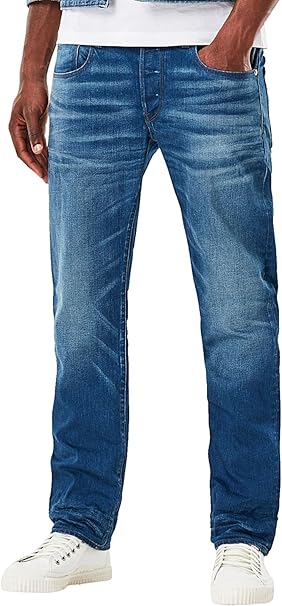 Front view of blue jeans featuring a faded design and slim fit on a white background.