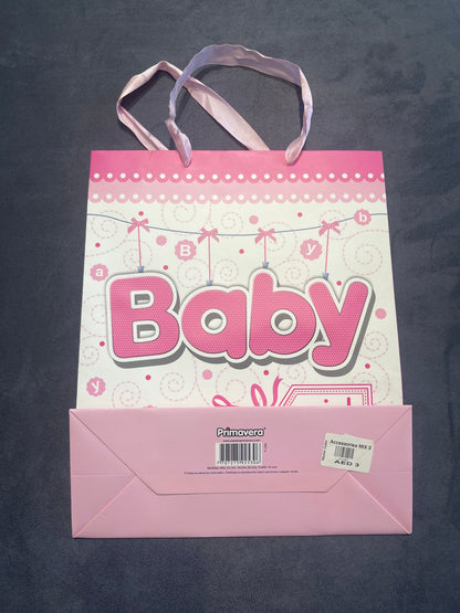 Baby girl pink gift bag with price label on base, front view