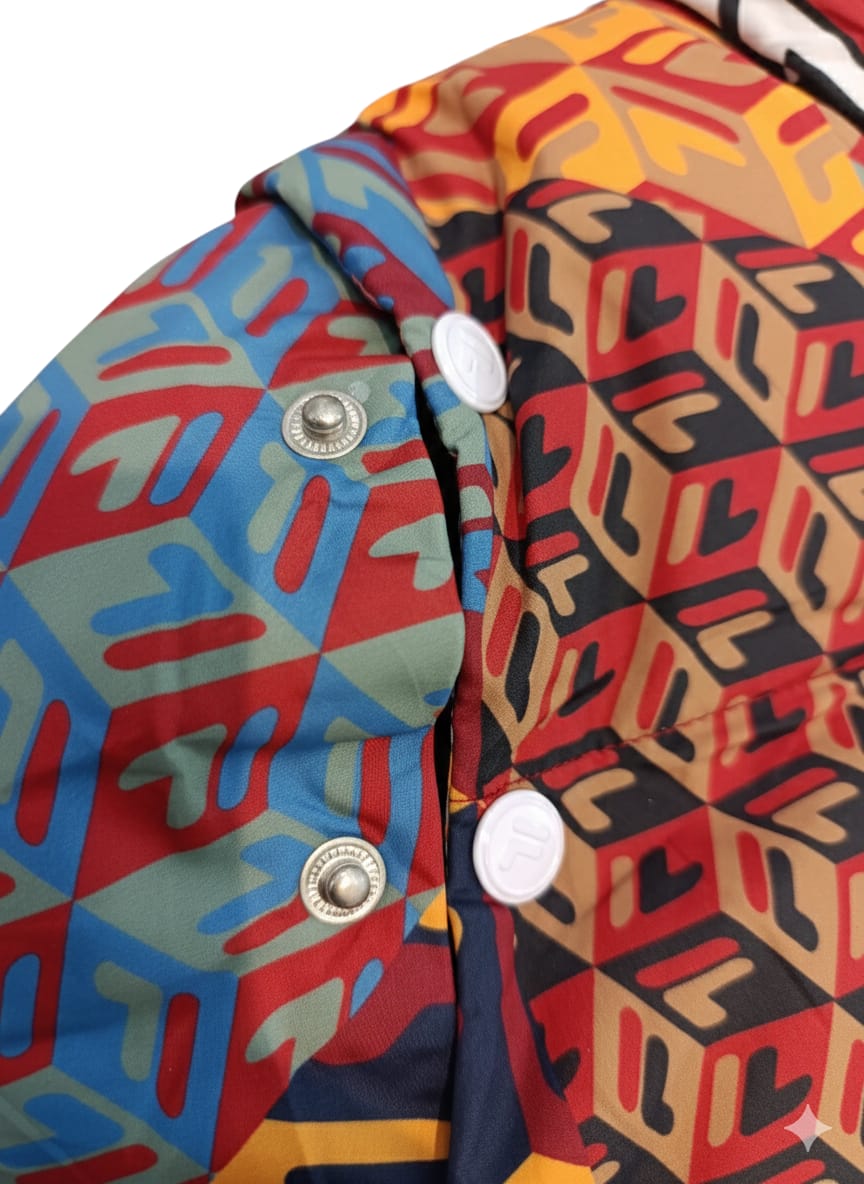 Close-up of Fila puffer snap buttons and geometric print