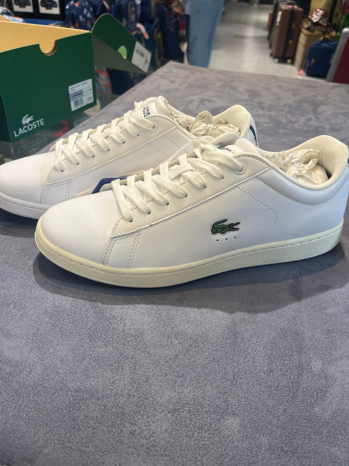 Lacoste Carnaby Pro white leather sneaker on table, side view