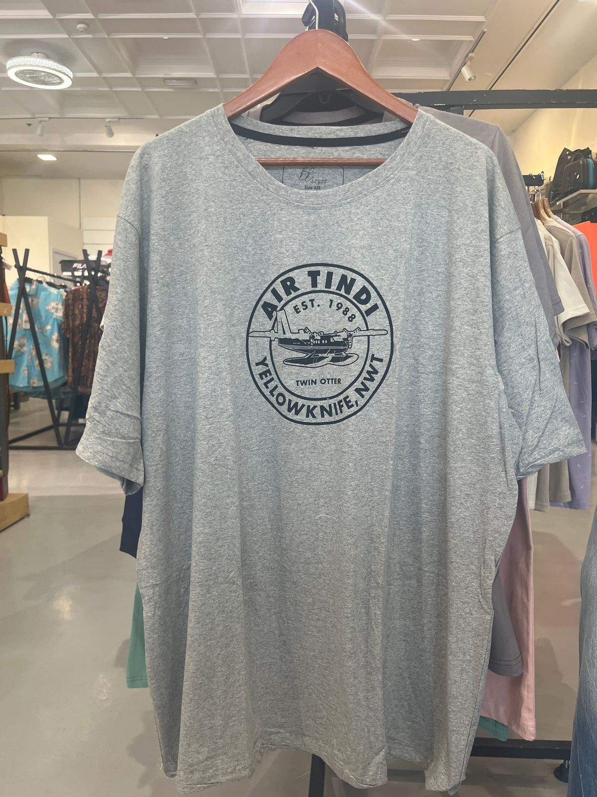 BS Style heather grey Air Tindi vintage graphic t-shirt, front view on hanger