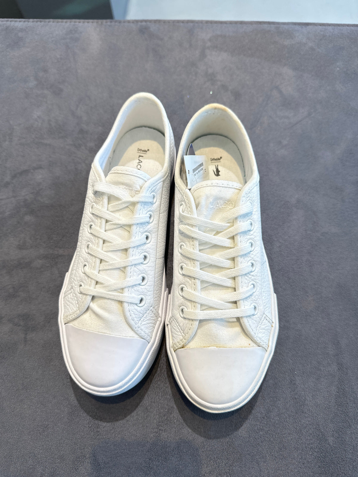 Lacoste white leather low-top sneakers, top view pair