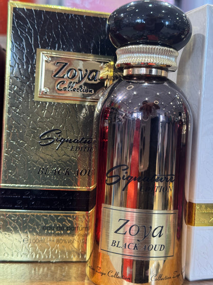 Zoya Black Aoud perfume bottle in front of gold box, close-up