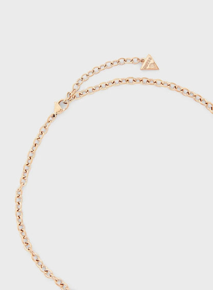 Close-up of rose gold chain and triangle logo charm on Guess necklace clasp