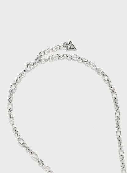 Close-up of silver chain links and triangle logo charm on Guess necklace