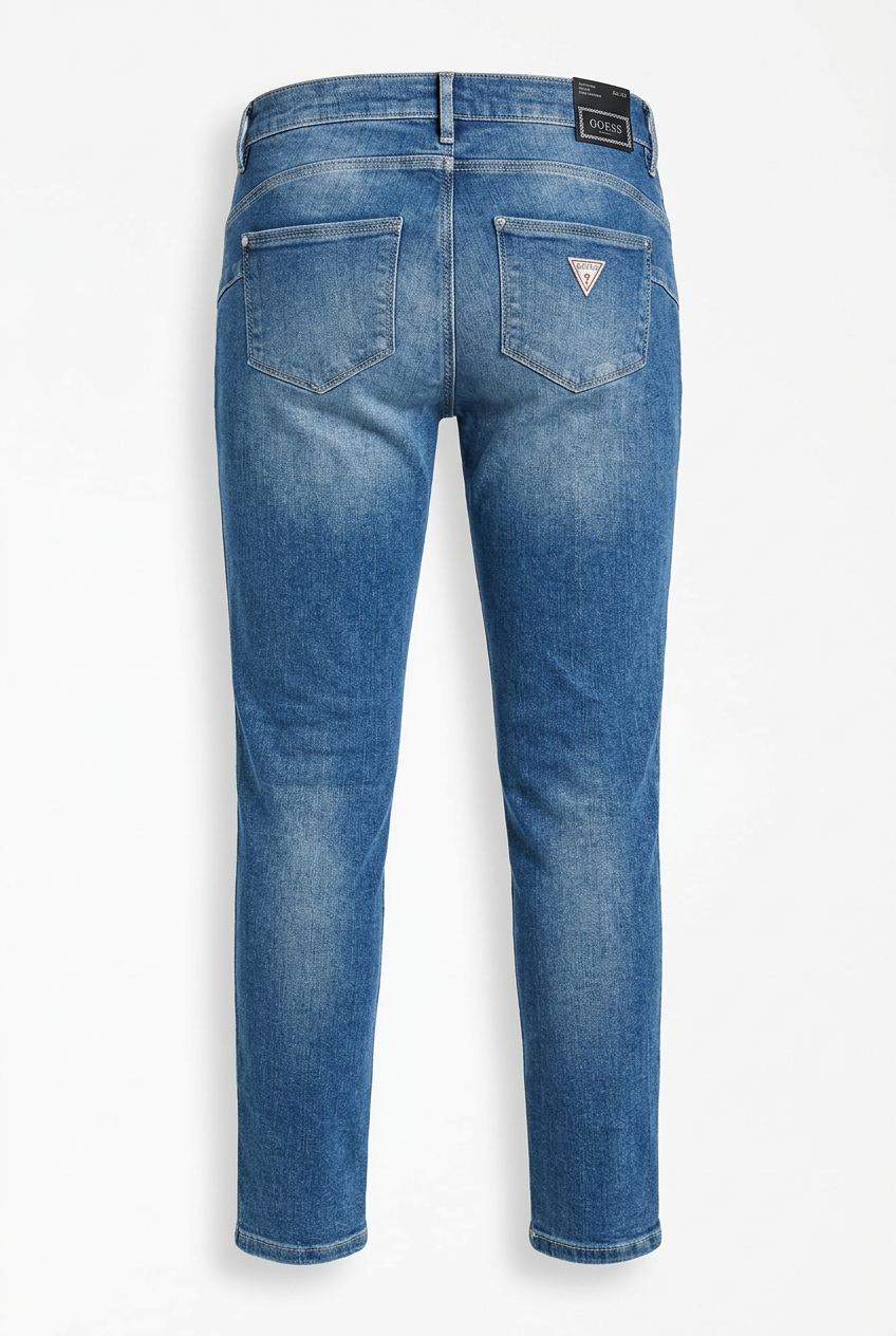 Back view of Guess blue skinny jeans showing pockets and triangle logo patch