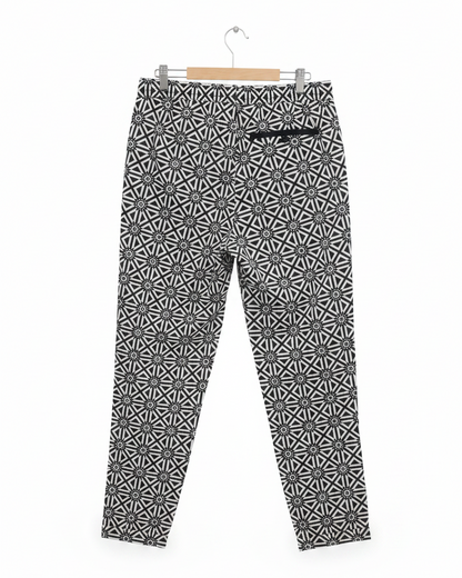 Back view of G-Star Raw black and white geometric pants showcasing the elastic waistband and pockets.