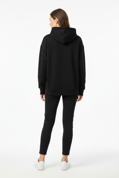 Woman in Fila black hoodie, back view