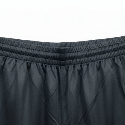 Close-up of black Fila shorts elastic waistband