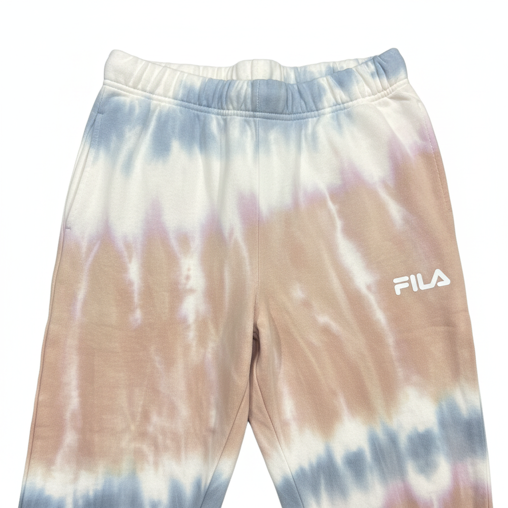 Close-up of Fila logo on tie-dye joggers