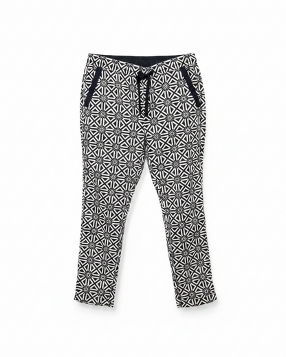 Front view of G-Star Raw geometric print pants featuring an elastic waistband and pockets.