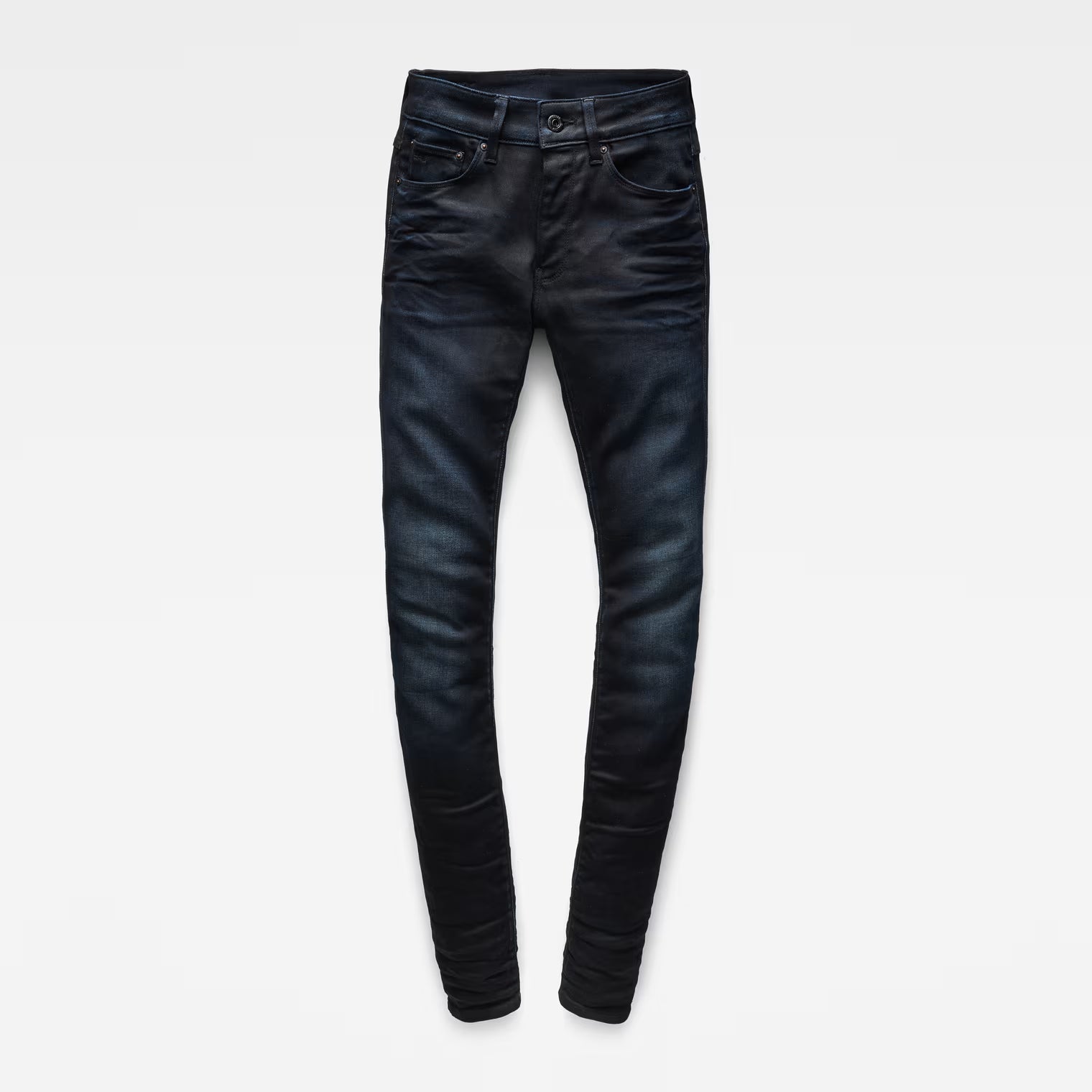 Laid flat view of dark blue skinny jeans highlighting the skinny fit.