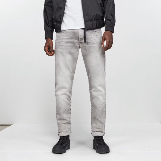 Front view of the grey tapered jeans featuring a regular fit and five pockets.