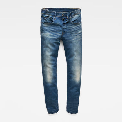 Front view of medium blue jeans with a straight fit and distressed details displayed on a white background.