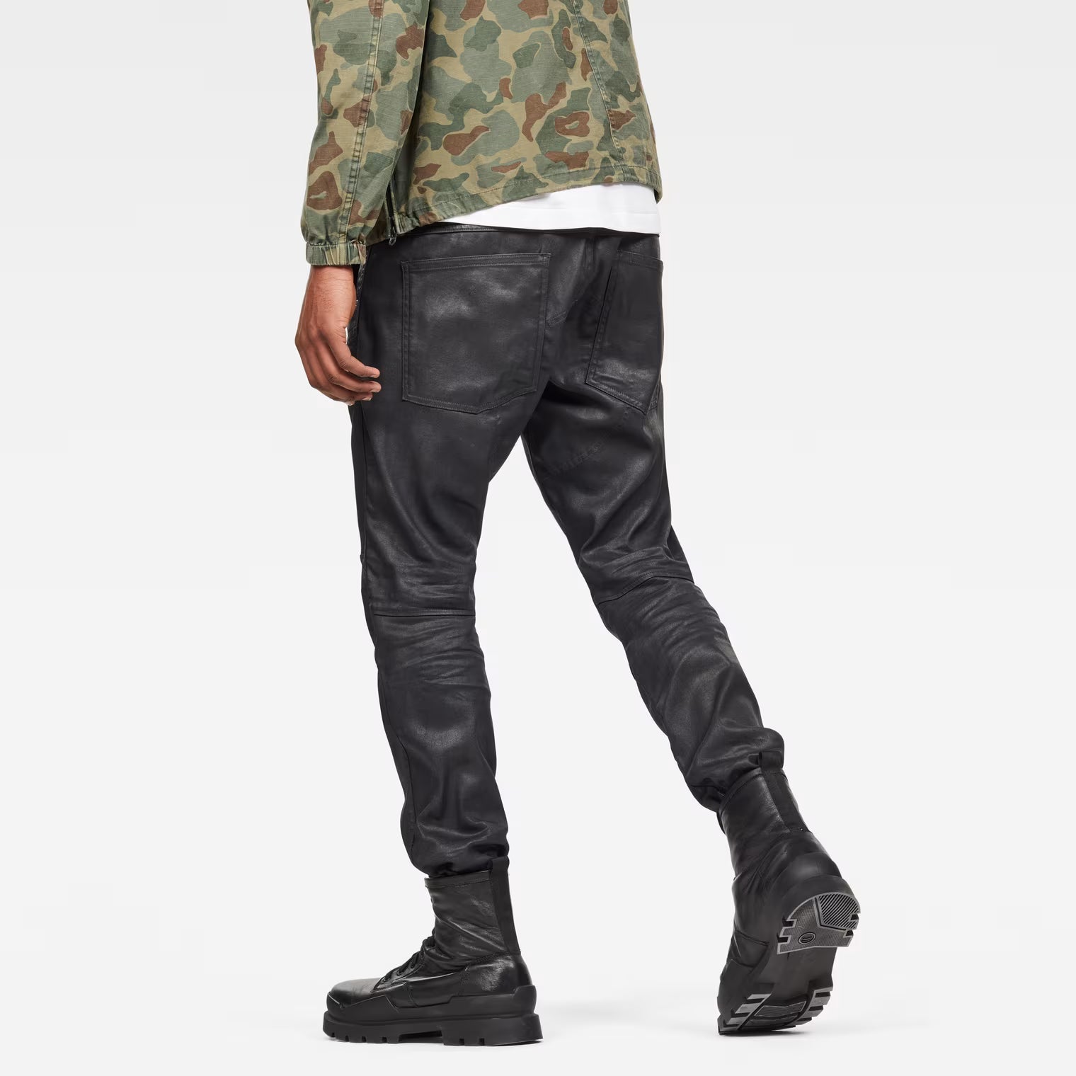 Back view of grey tapered jeans showcasing the 3D design and straight fit on a white background.