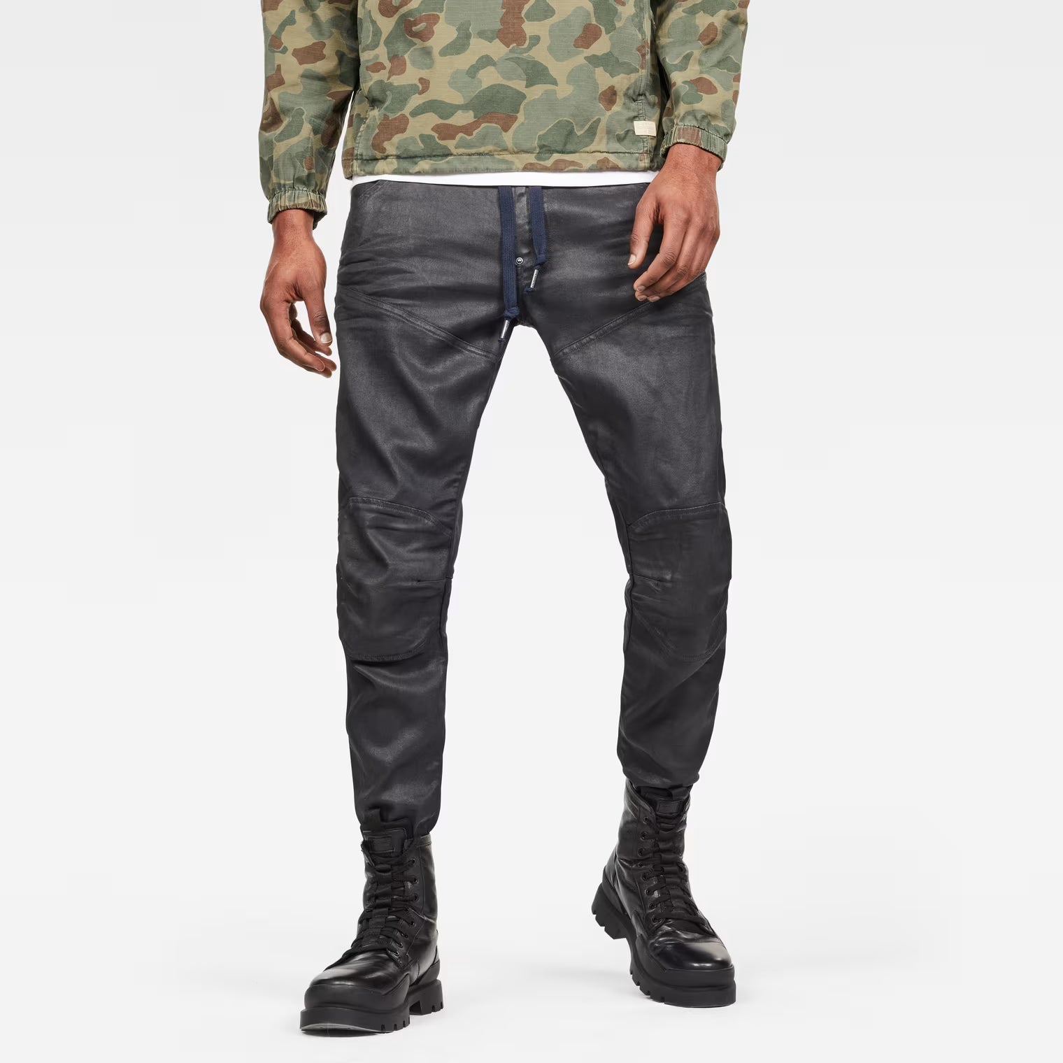 Front view of grey tapered jeans featuring a 3D design and straight fit on a white background.