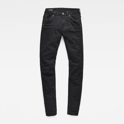 Packaging view of black skinny jeans with mid waist and skinny fit on a white background