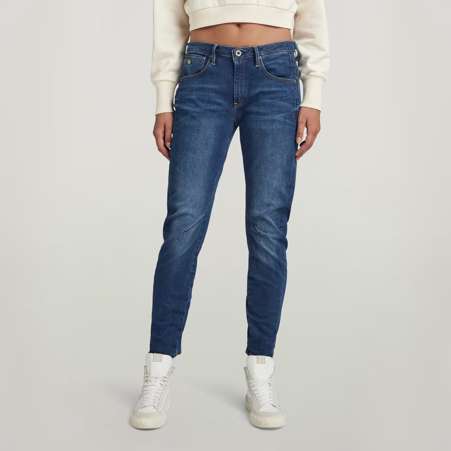 Front view of dark blue boyfriend jeans featuring a low waist and skinny fit.