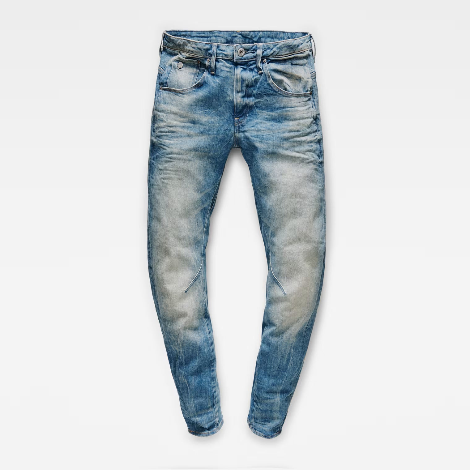 Front view of medium blue boyfriend jeans with a skinny fit and distressed look on a transparent background.