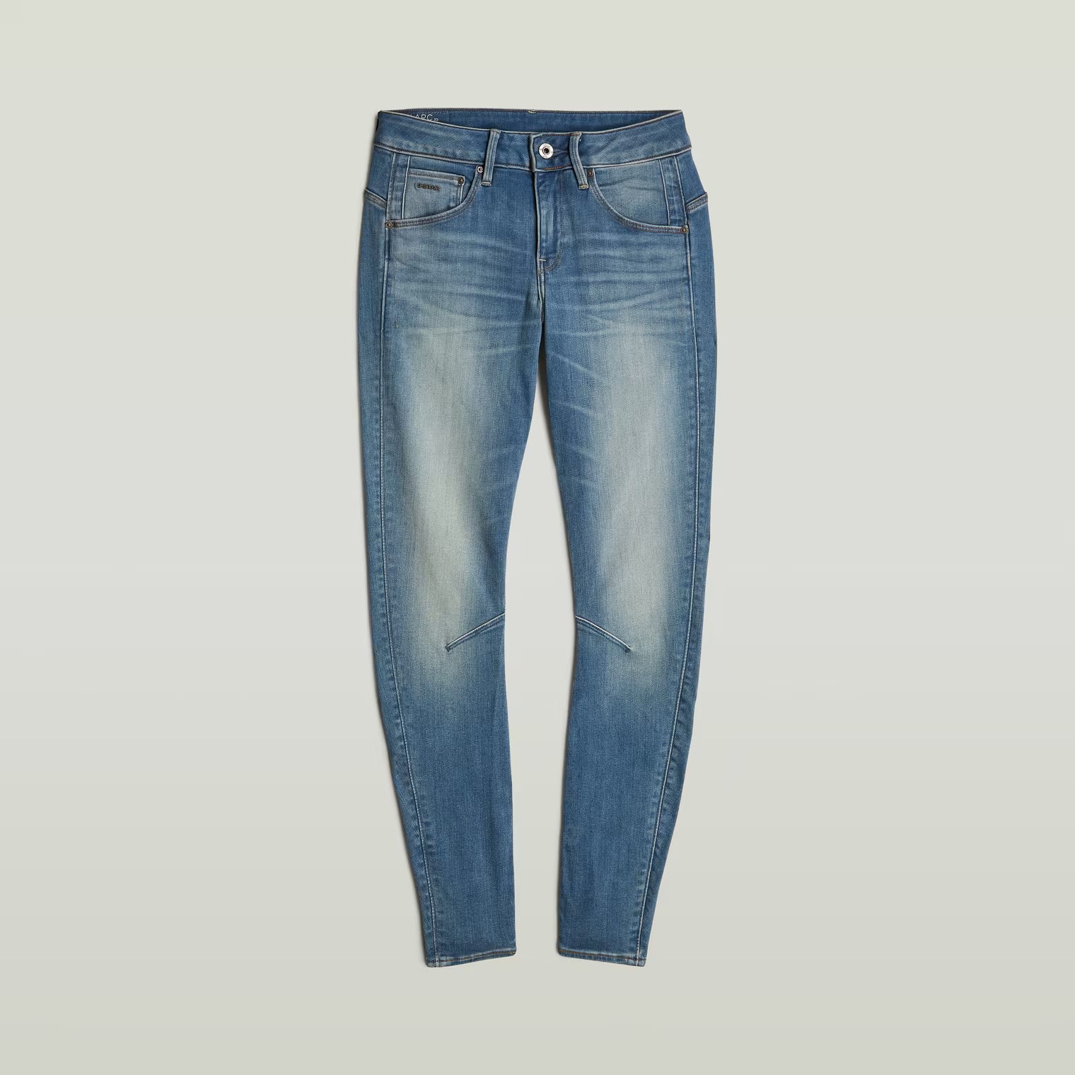 Packaging view of blue skinny jeans featuring a faded design and slim fit.