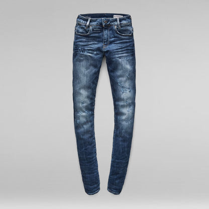 Front view of medium blue skinny jeans with a mid waist and skinny fit.