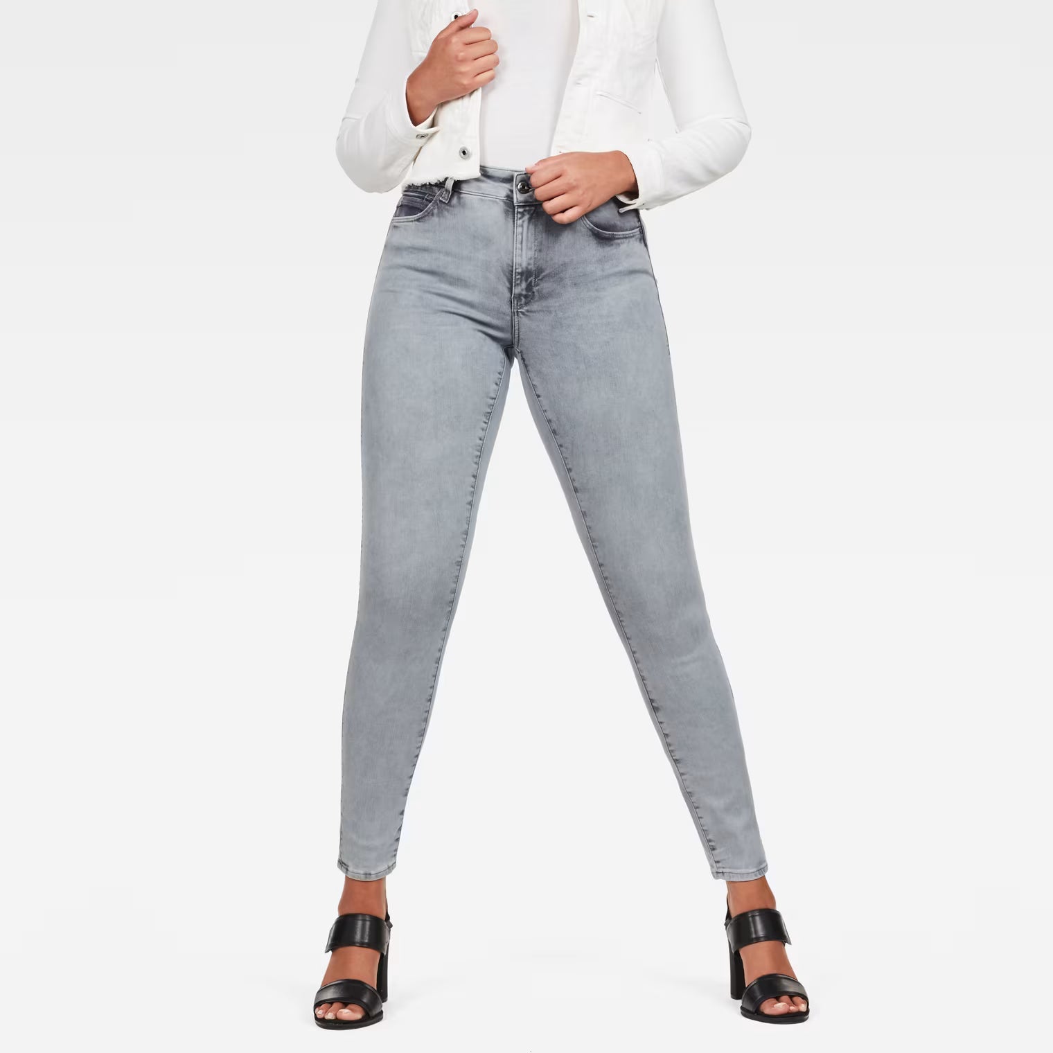 Front view of light blue skinny jeans featuring a high waist and super skinny fit.