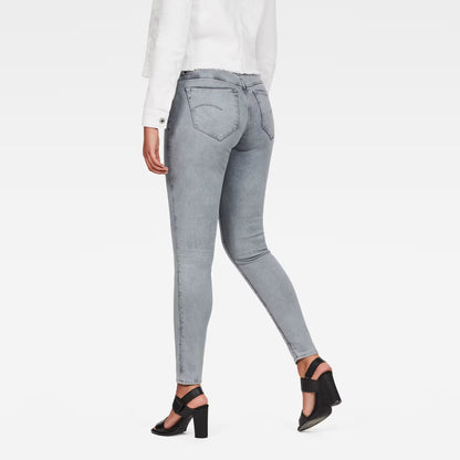 Back view of light blue skinny jeans showcasing the high waist and super skinny fit.