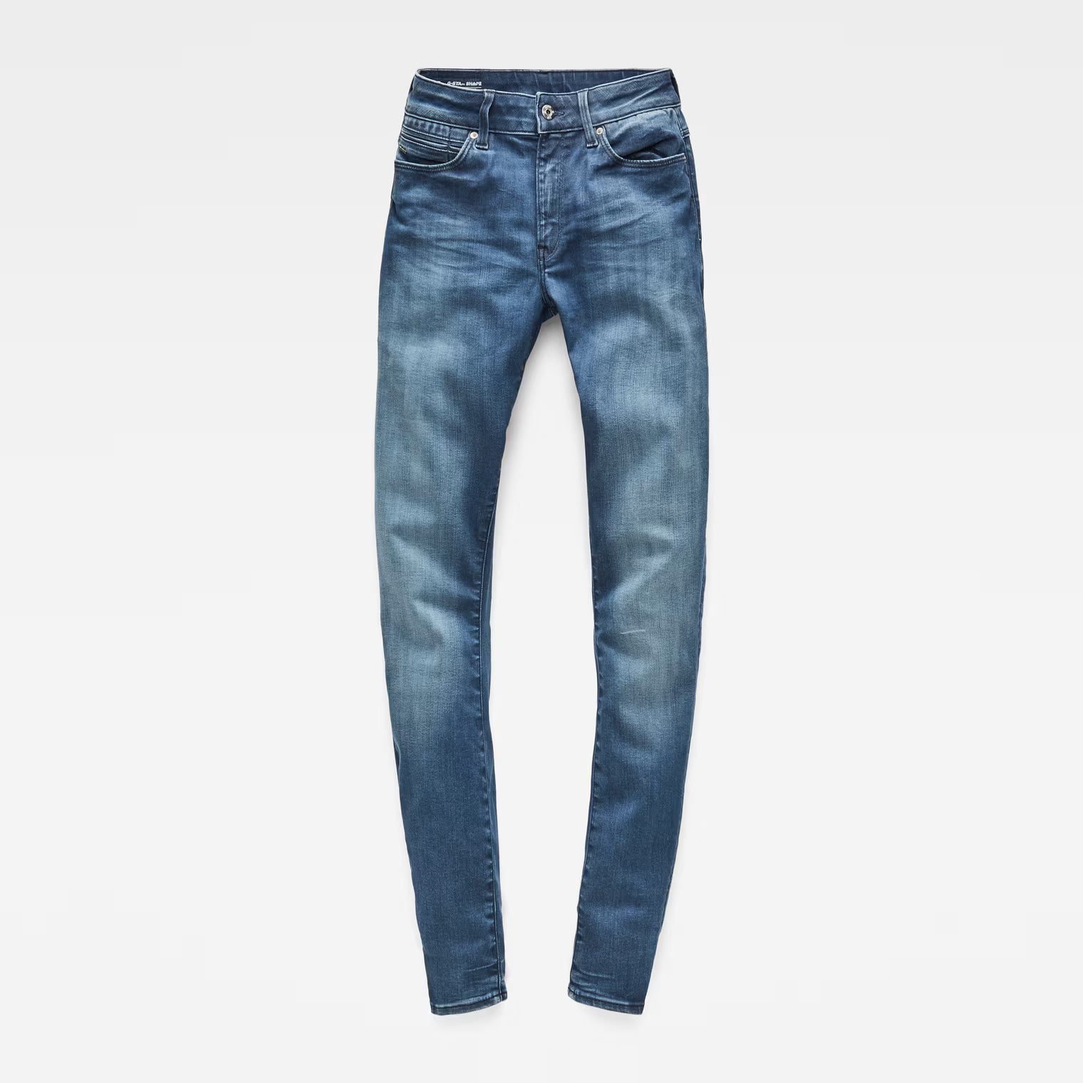 Front view of medium blue skinny jeans with a fitted design and high waist.