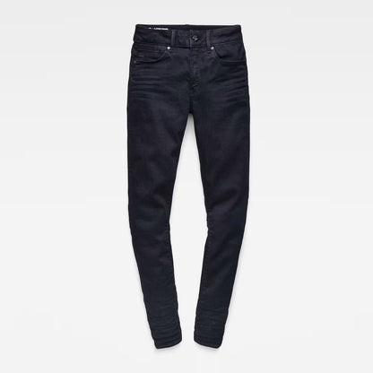 Flat lay of black skinny jeans with a high waist on a white background.