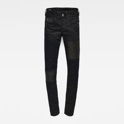 Front view of black skinny jeans showcasing a mid-rise fit on a white background.