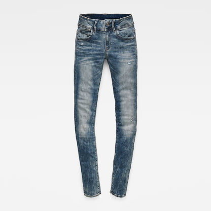 Front view of light blue skinny jeans showcasing a mid waist fit on a white background