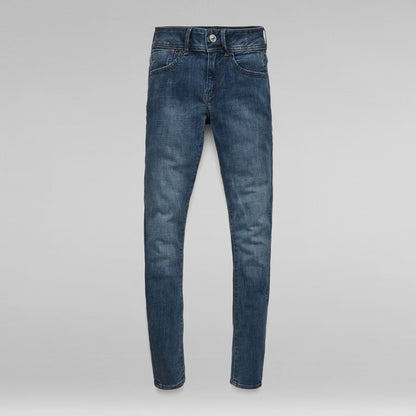 Packaging view of dark blue skinny jeans with the front visible and label shown.
