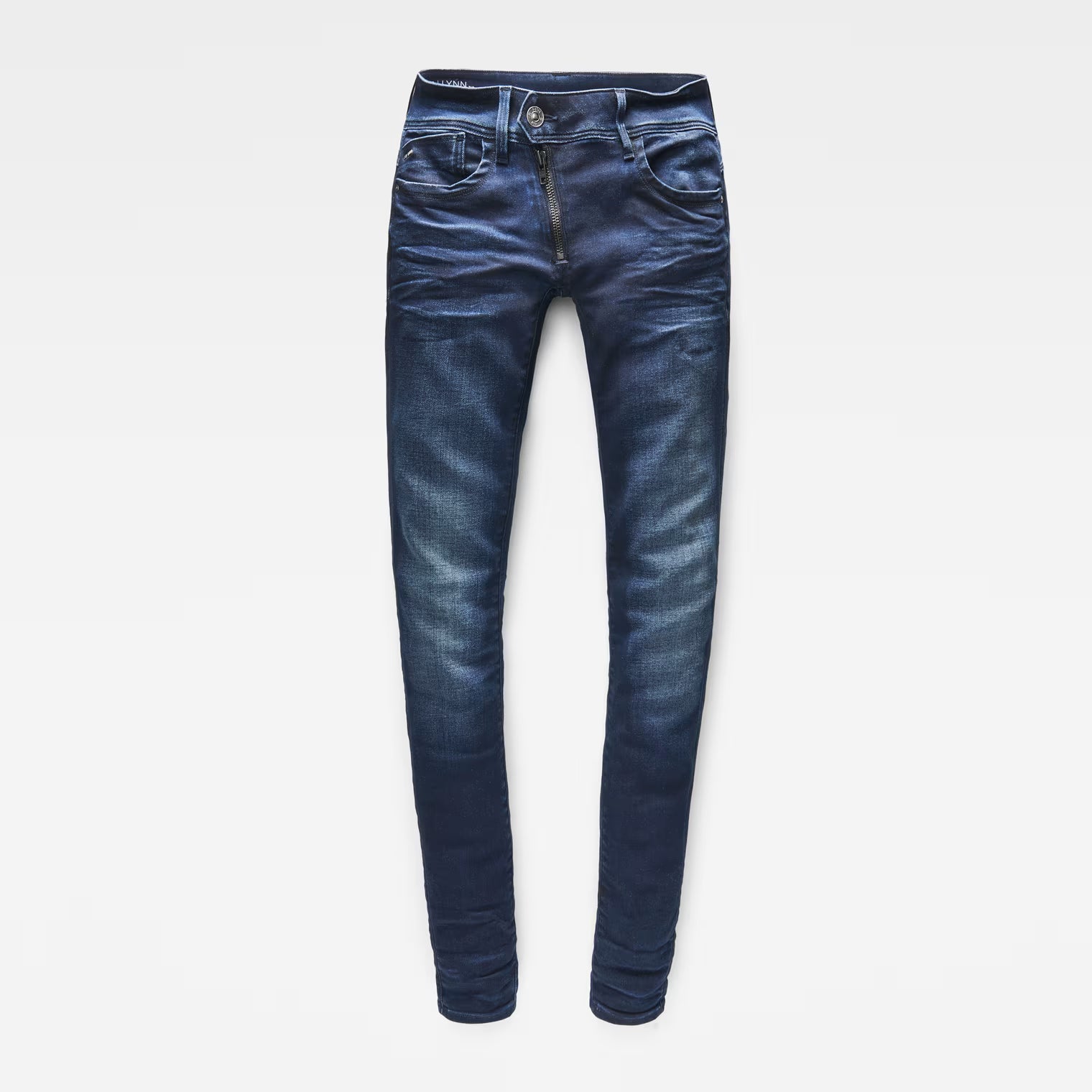 Front view of dark blue skinny jeans with a mid waist and skinny fit on a white background.