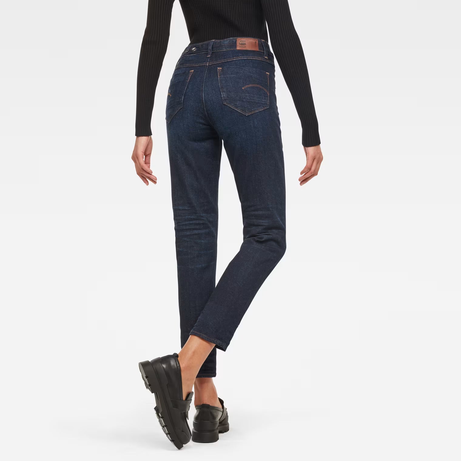 Back view of dark blue high waist straight ankle jeans showcasing the fit and design.