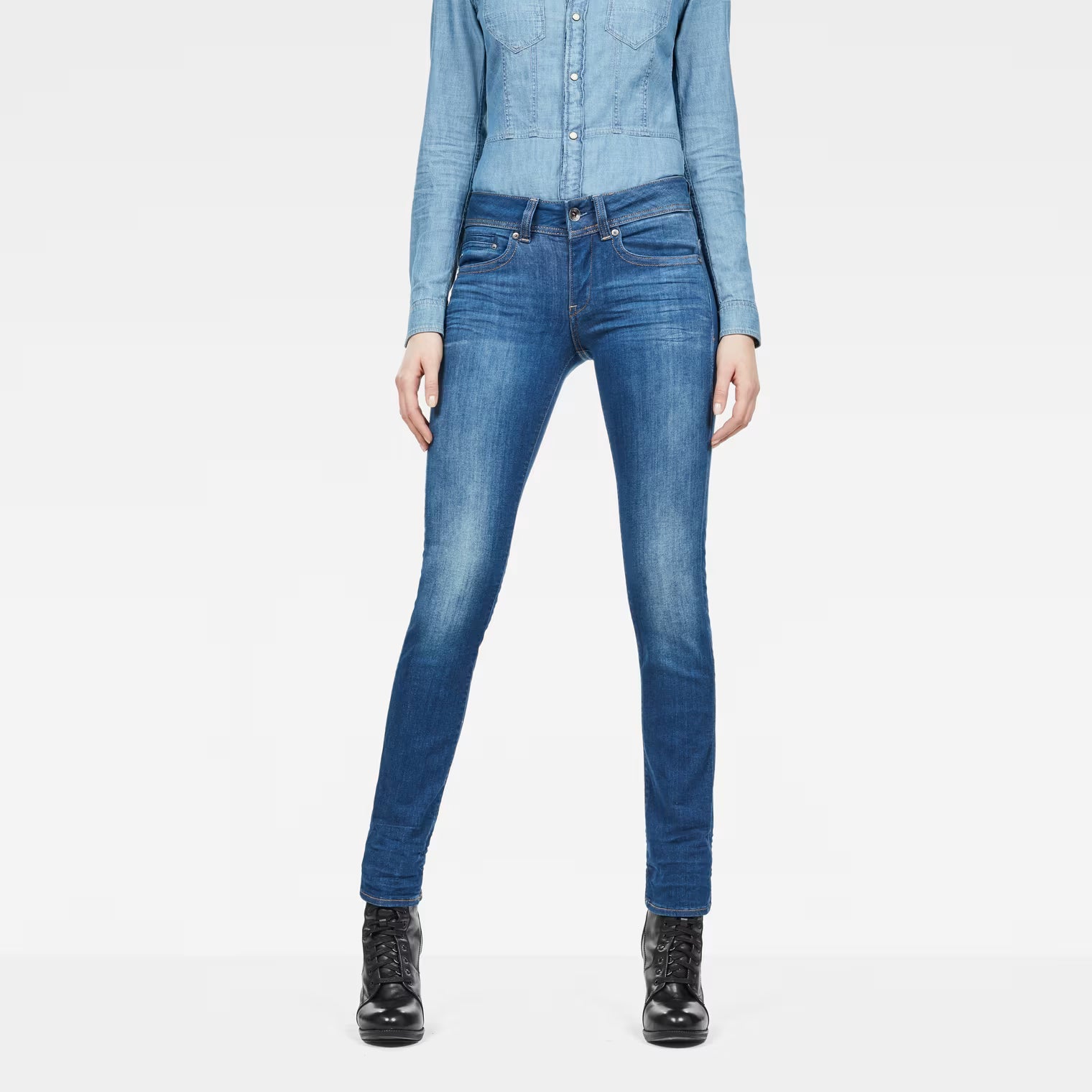 Front view of medium blue jeans featuring a mid waist and straight fit on a white background.