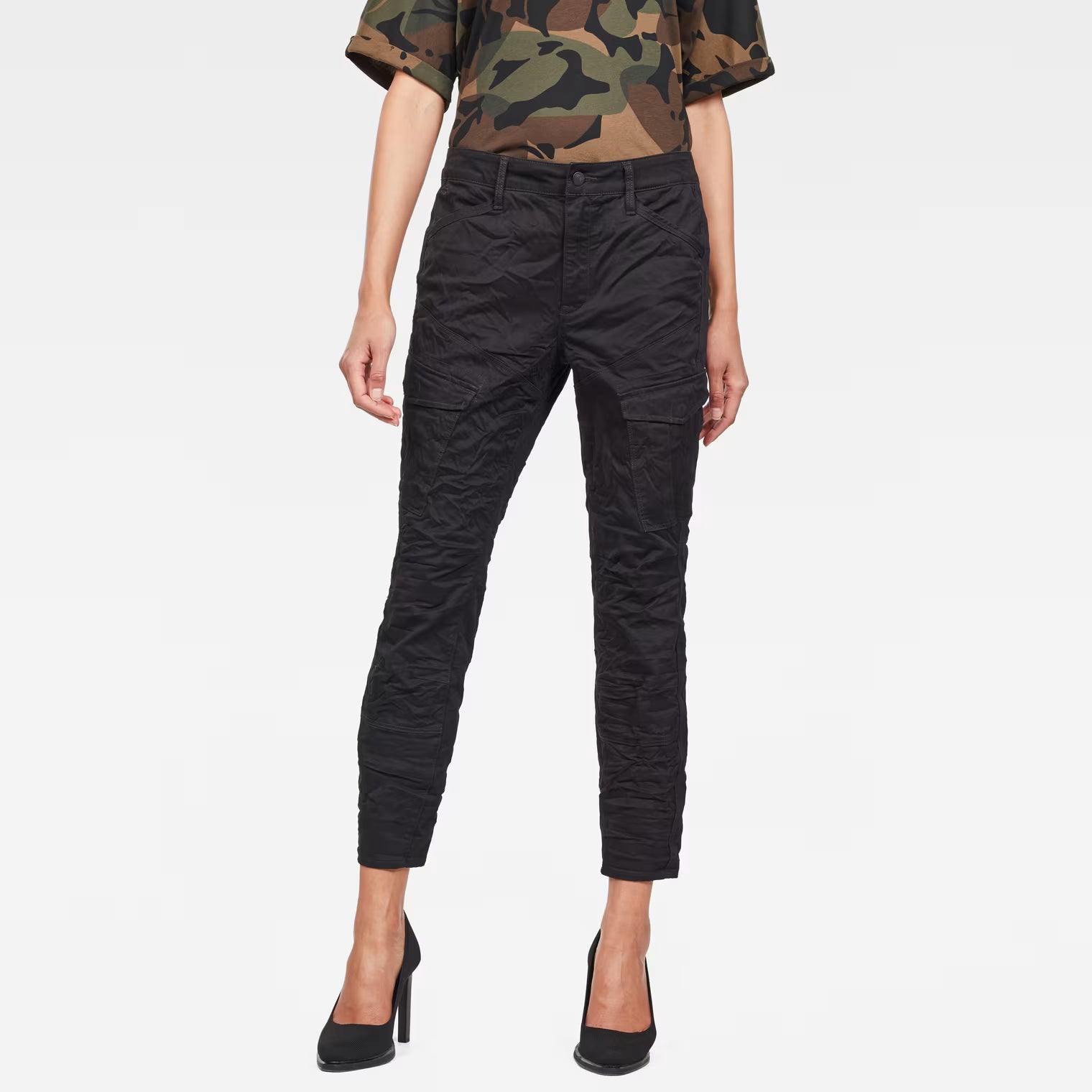 Front view of the black skinny cargo pants featuring mid waist and cargo pockets.